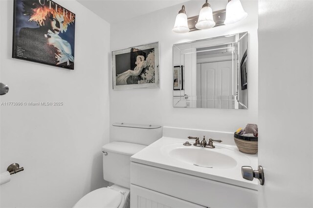 half bath with vanity and toilet