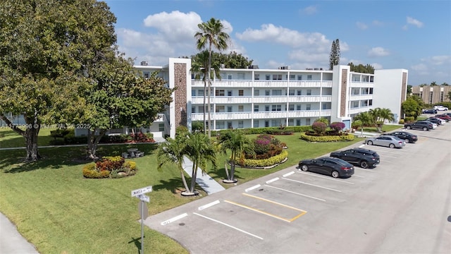 view of property featuring uncovered parking