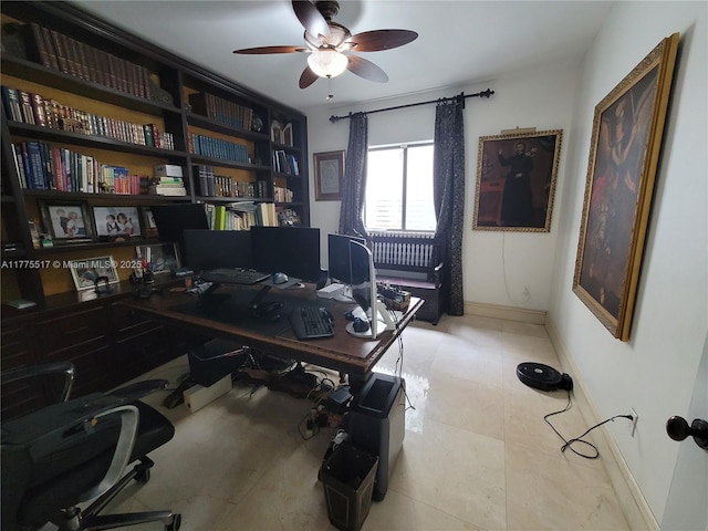 home office with baseboards and ceiling fan