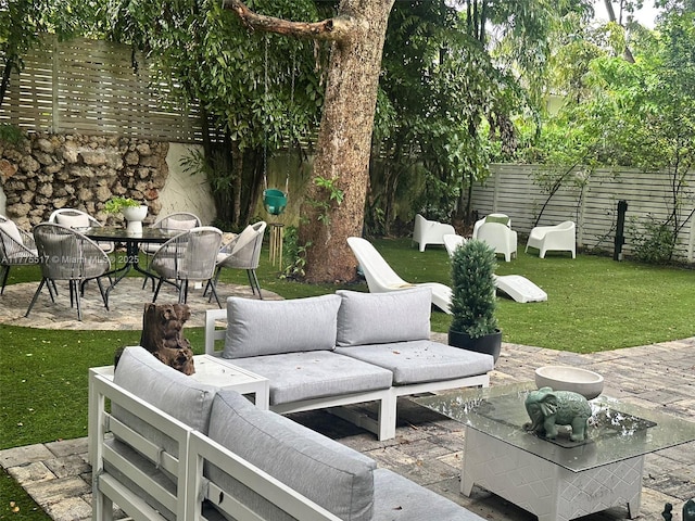 view of patio / terrace featuring outdoor lounge area, fence, and outdoor dining space