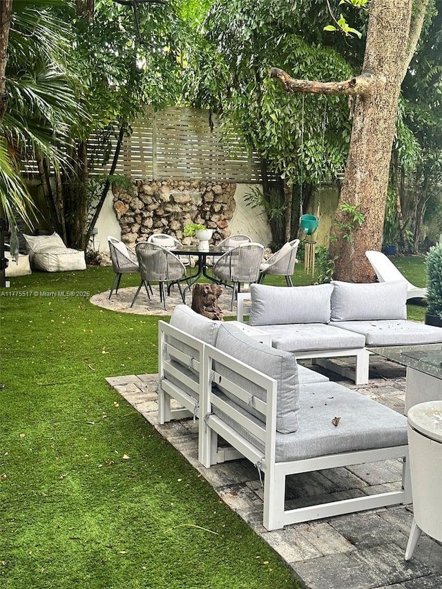 view of patio / terrace featuring fence and an outdoor living space
