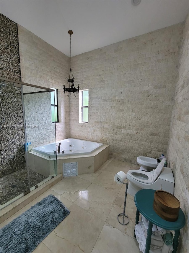 full bath featuring a stall shower, toilet, a tub with jets, a bidet, and an inviting chandelier
