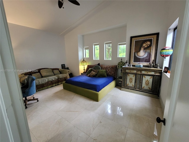 bedroom with marble finish floor, high vaulted ceiling, and ceiling fan