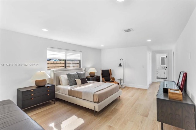 bedroom with light wood-type flooring, baseboards, visible vents, and recessed lighting