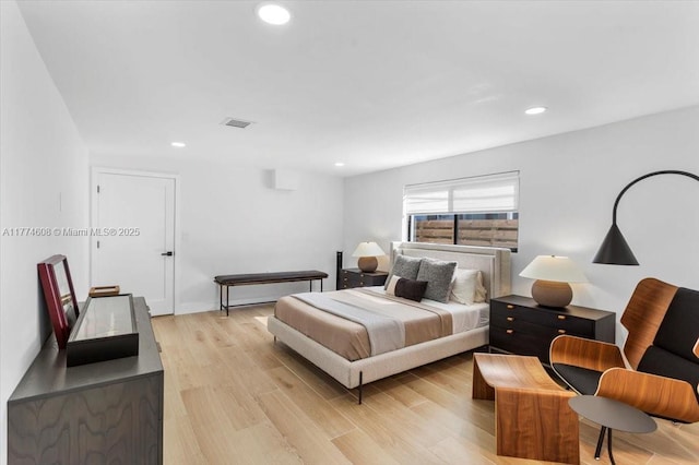 bedroom with light wood-style floors, visible vents, and recessed lighting