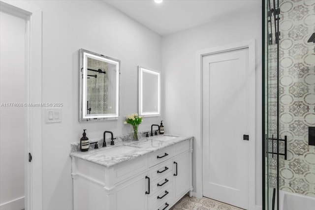 bathroom featuring double vanity and a sink