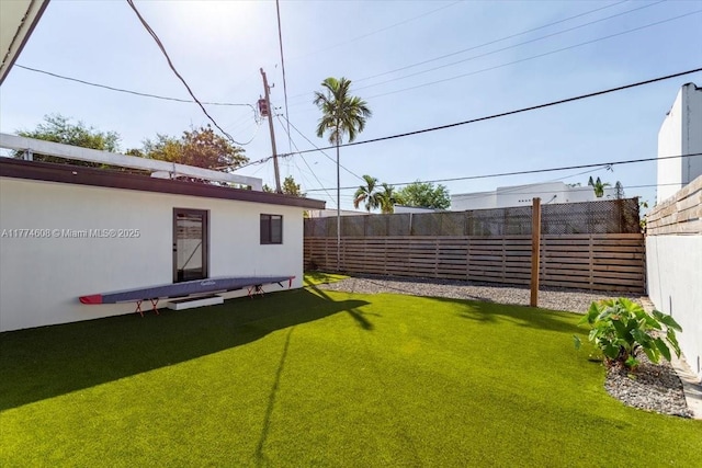 view of yard with a fenced backyard