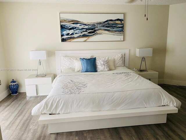 20785 SW 129th Ct, Miami, FL 33177 - bedroom featuring baseboards and wood finished floors