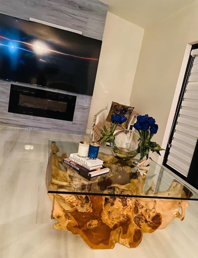 room details featuring a glass covered fireplace