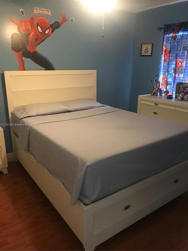 bedroom featuring wood finished floors