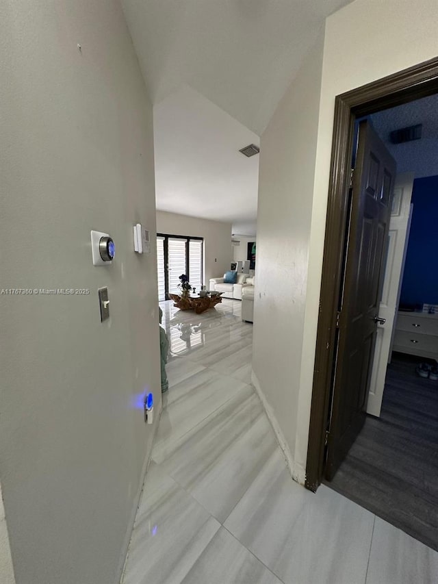 corridor with visible vents and baseboards
