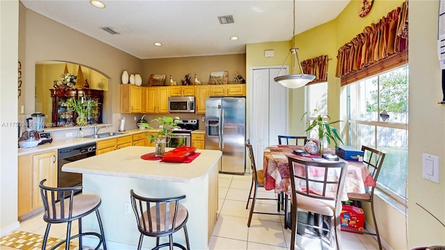kitchen featuring a sink, light countertops, visible vents, and appliances with stainless steel finishes