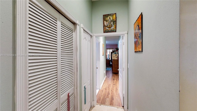 hallway with light wood-style floors