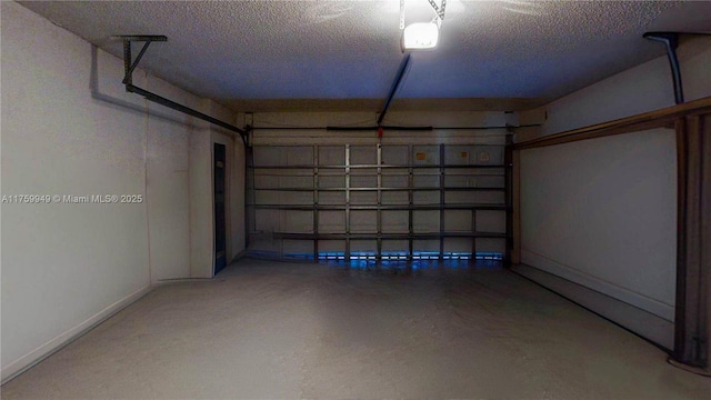 garage featuring baseboards and a garage door opener