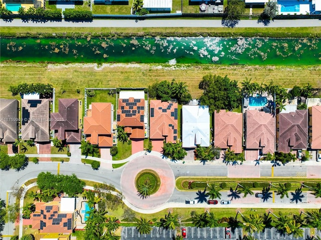 aerial view with a water view and a residential view