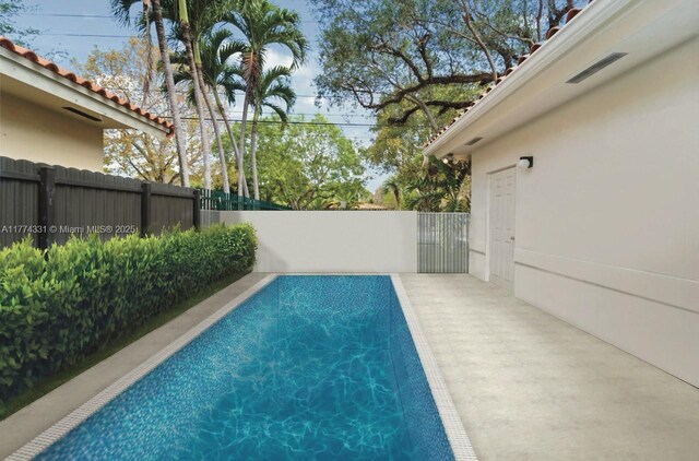 view of pool featuring a fenced in pool and fence