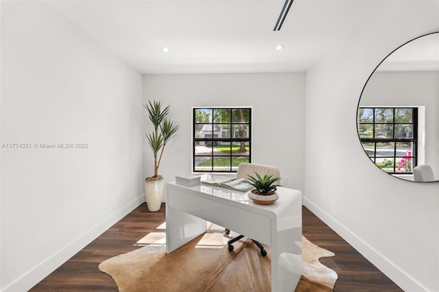 home office featuring baseboards, plenty of natural light, and recessed lighting
