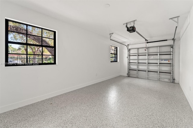garage featuring baseboards and a garage door opener