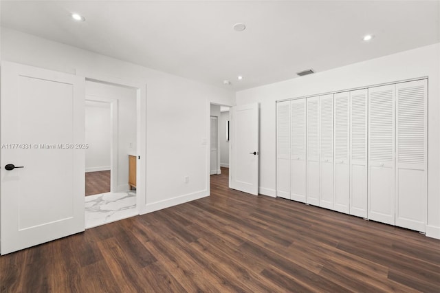 unfurnished bedroom with recessed lighting, visible vents, dark wood-style flooring, and baseboards