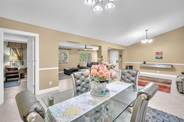 2343 SW 15th Pl, Deerfield Beach, FL 33442 - tiled dining area with vaulted ceiling, baseboards, a chandelier, and a textured ceiling