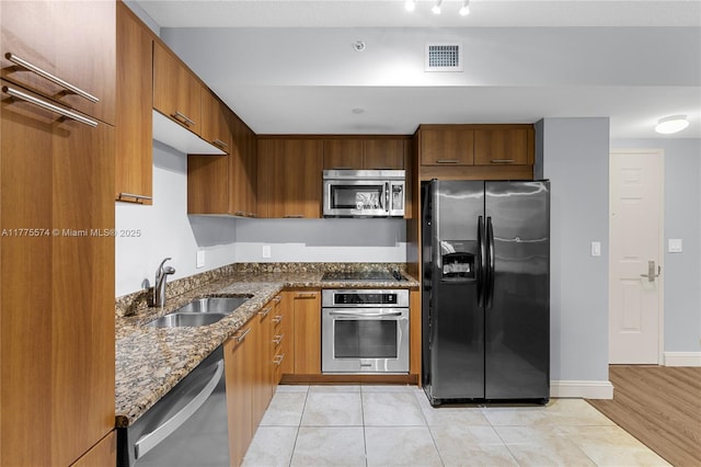 510 NW 84th Ave Unit 242, Plantation, FL 33324 - kitchen featuring stainless steel appliances, a sink, dark stone counters, and modern cabinets