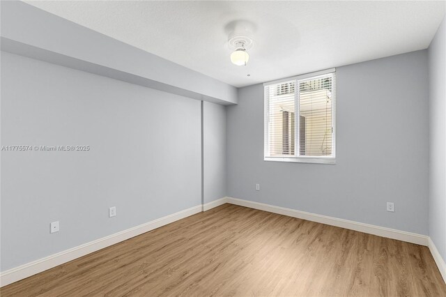 510 NW 84th Ave Unit 242, Plantation, FL 33324 - empty room featuring light wood finished floors and baseboards