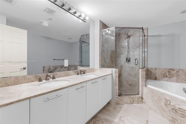510 NW 84th Ave Unit 242, Plantation, FL 33324 - full bath with double vanity, a garden tub, and a stall shower