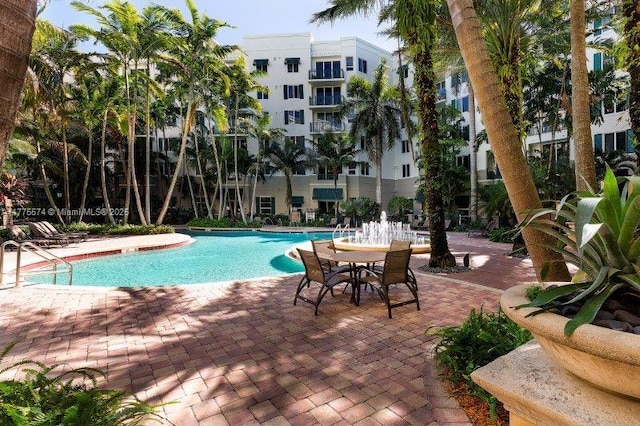 community pool with a patio