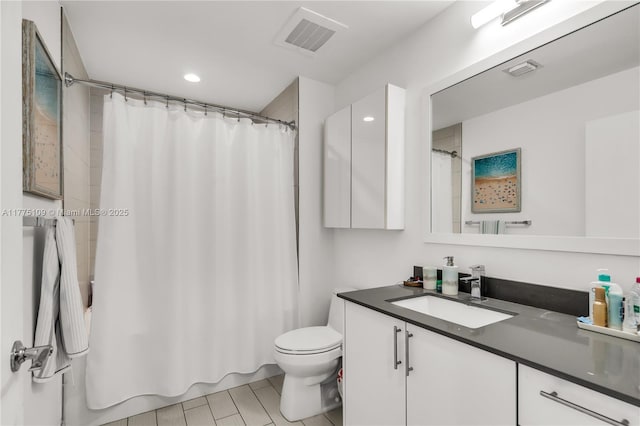 full bathroom featuring toilet, vanity, shower / tub combo, and visible vents
