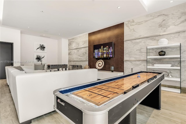 game room with recessed lighting and tile walls