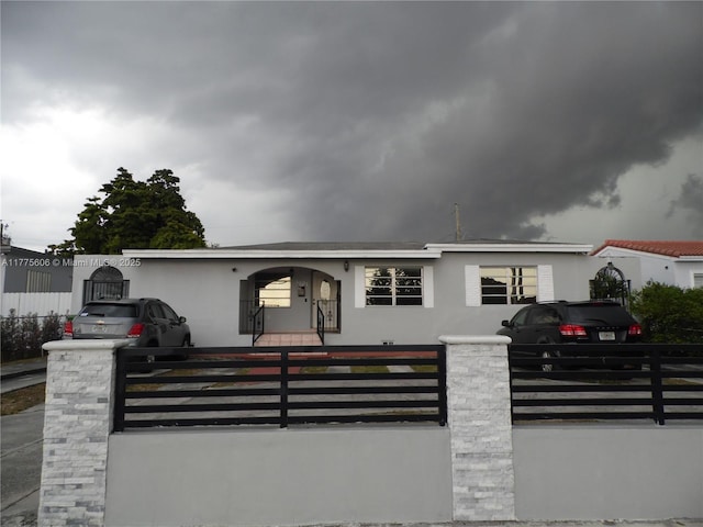 3491 Palm Ave, Hialeah, FL 33012 - view of front of property featuring a fenced front yard and stucco siding