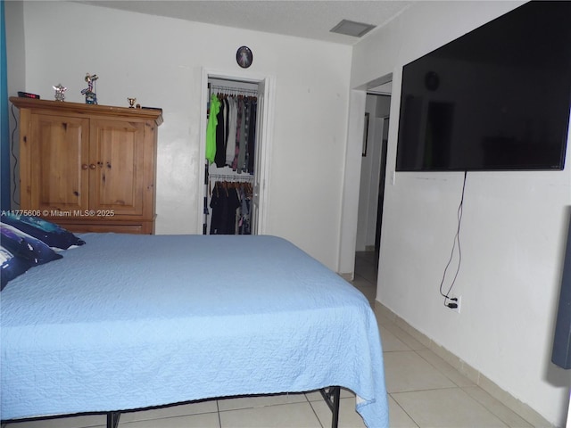 3491 Palm Ave, Hialeah, FL 33012 - bedroom with light tile patterned floors, a closet, and a walk in closet