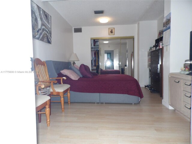3491 Palm Ave, Hialeah, FL 33012 - bedroom featuring light wood-style flooring and a closet