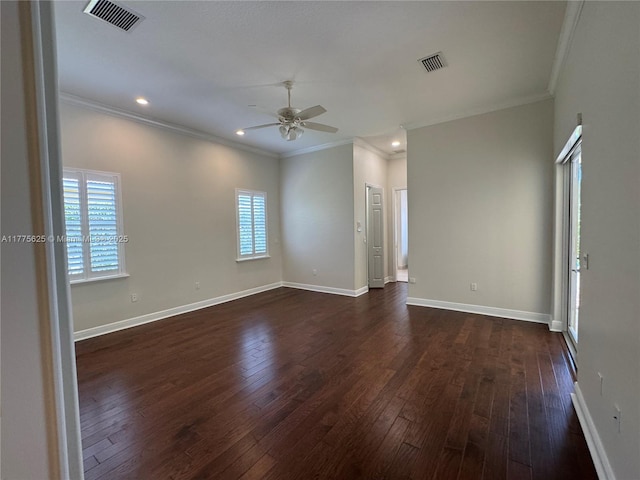 empty room with a ceiling fan, crown molding, dark wood finished floors, recessed lighting, and baseboards