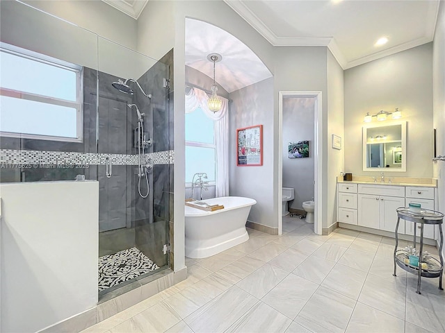 bathroom with a stall shower, ornamental molding, healthy amount of natural light, a soaking tub, and vanity