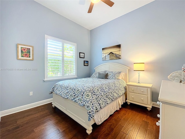 bedroom with dark wood-type flooring, baseboards, and a ceiling fan