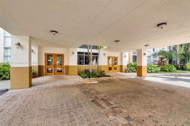 9805 NW 52nd St Unit 306, Doral, FL 33178 - view of patio / terrace featuring french doors
