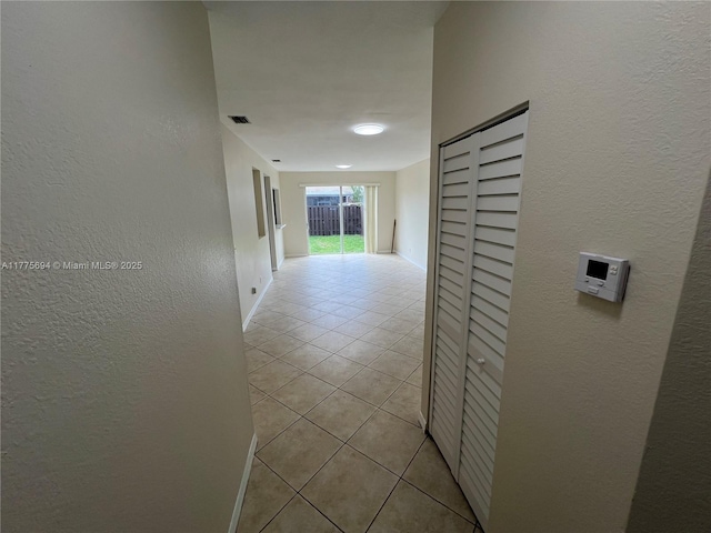 100 SW 15th Ave, Homestead, FL 33030 - hallway with light tile patterned flooring and a textured wall