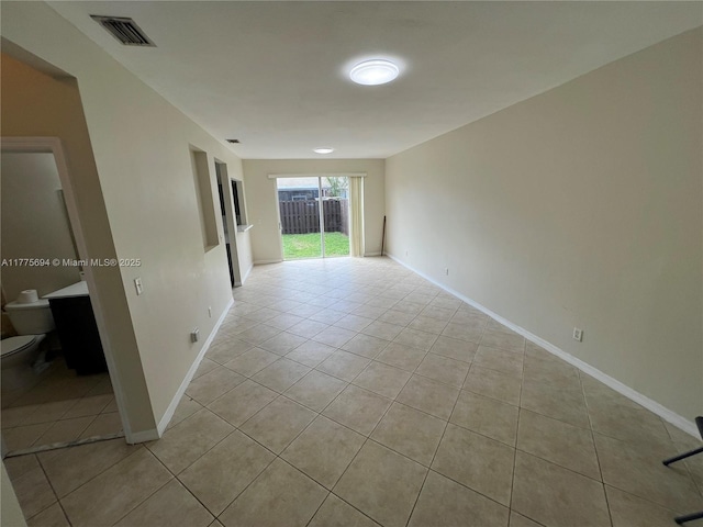 100 SW 15th Ave, Homestead, FL 33030 - unfurnished room with light tile patterned floors and baseboards