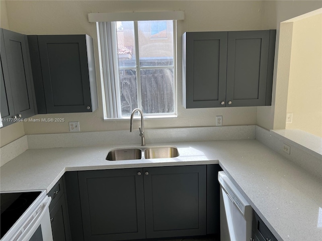 100 SW 15th Ave, Homestead, FL 33030 - kitchen with a sink, gray cabinets, white appliances, and light countertops