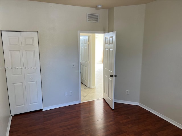 100 SW 15th Ave, Homestead, FL 33030 - unfurnished bedroom with wood finished floors and baseboards