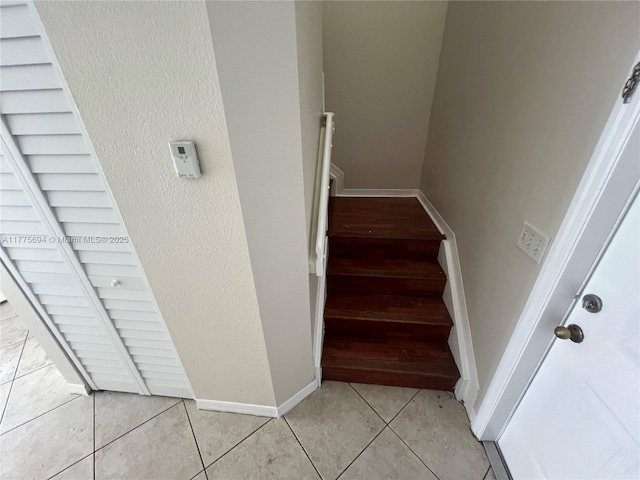 100 SW 15th Ave, Homestead, FL 33030 - staircase featuring baseboards and tile patterned flooring