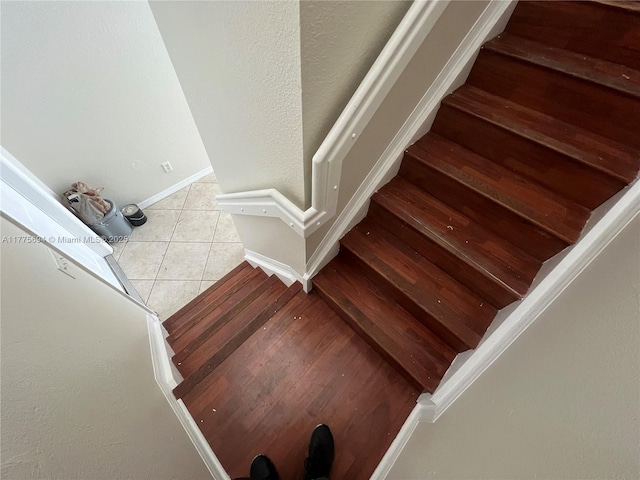 100 SW 15th Ave, Homestead, FL 33030 - staircase featuring tile patterned flooring and baseboards