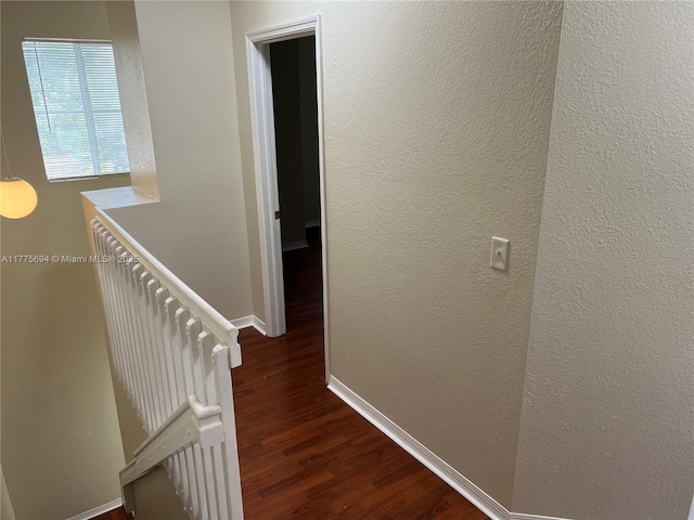 100 SW 15th Ave, Homestead, FL 33030 - hallway with wood finished floors, an upstairs landing, baseboards, and a textured wall