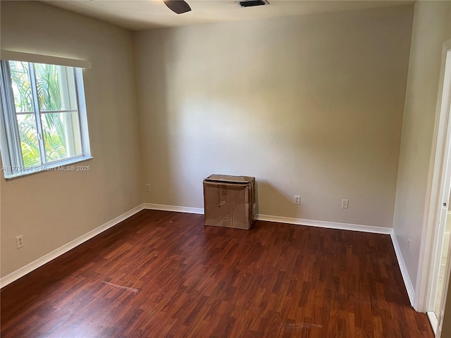 100 SW 15th Ave, Homestead, FL 33030 - empty room with dark wood-style floors and baseboards