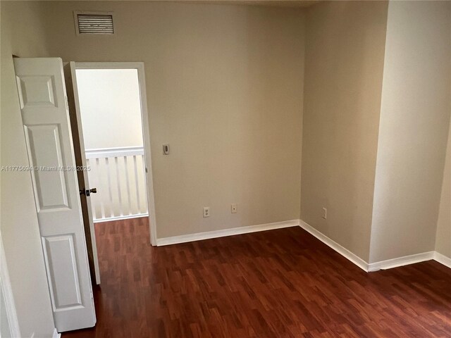 100 SW 15th Ave, Homestead, FL 33030 - unfurnished room with dark wood-type flooring and baseboards