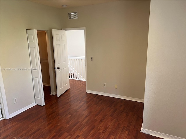 100 SW 15th Ave, Homestead, FL 33030 - empty room with dark wood finished floors and baseboards