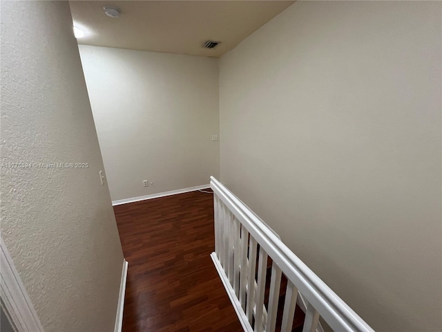 100 SW 15th Ave, Homestead, FL 33030 - corridor with dark wood-style flooring, baseboards, and an upstairs landing