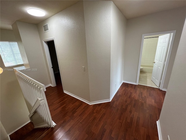 100 SW 15th Ave, Homestead, FL 33030 - hall with dark wood-style floors, an upstairs landing, and baseboards