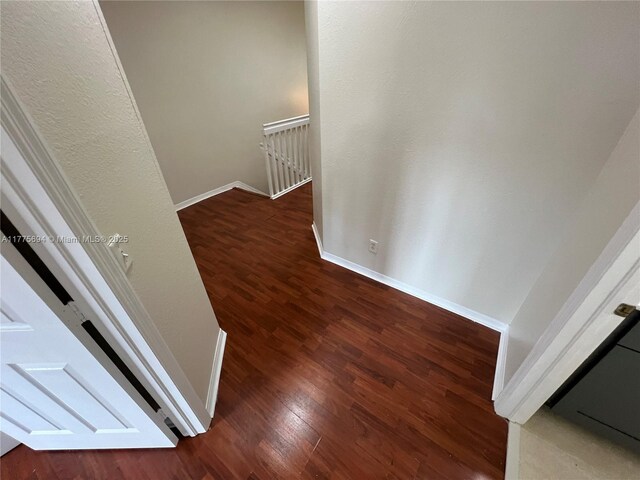 100 SW 15th Ave, Homestead, FL 33030 - hall with an upstairs landing, wood finished floors, and baseboards